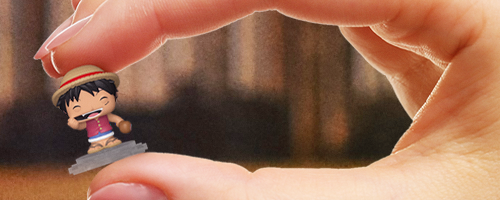 close up of hand holding Funko Bitty POP! One Piece Luffy