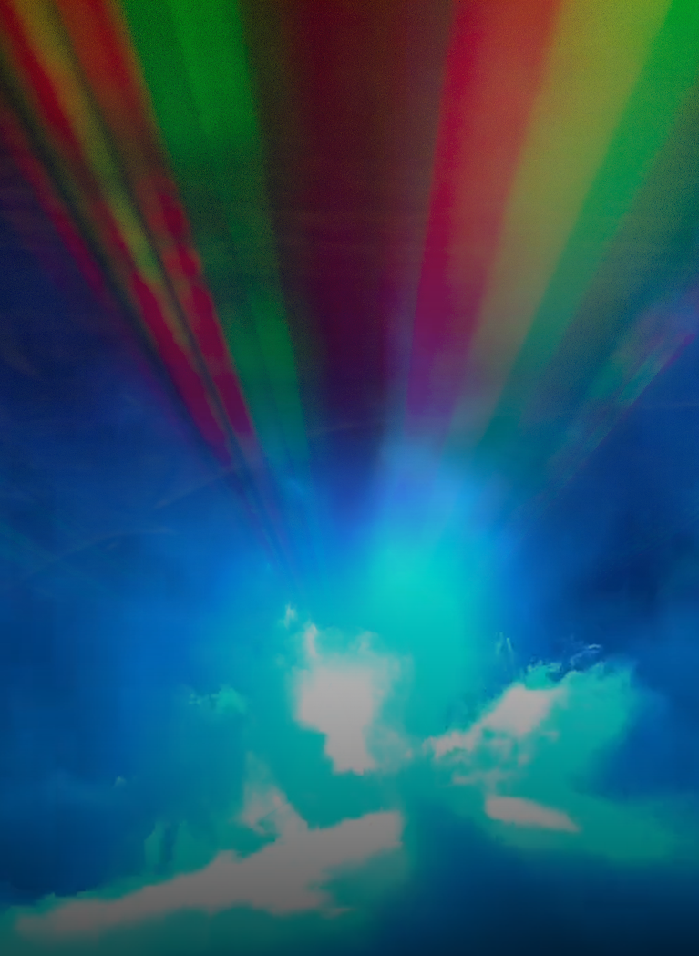 Abstract blue background with colourful laser beams and fog creating a futuristic lighting effect.