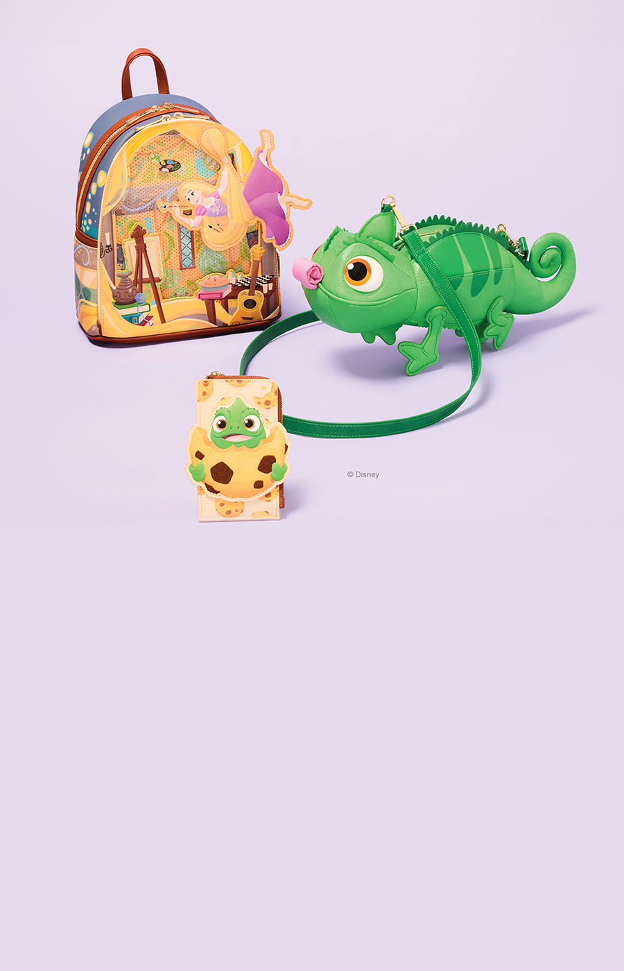 lilac background with selection of Loungefly Disney Tangled accessories