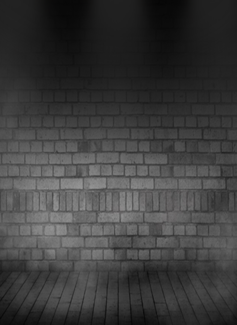 Dark brick wall stage with dramatic spotlights and smoky atmosphere