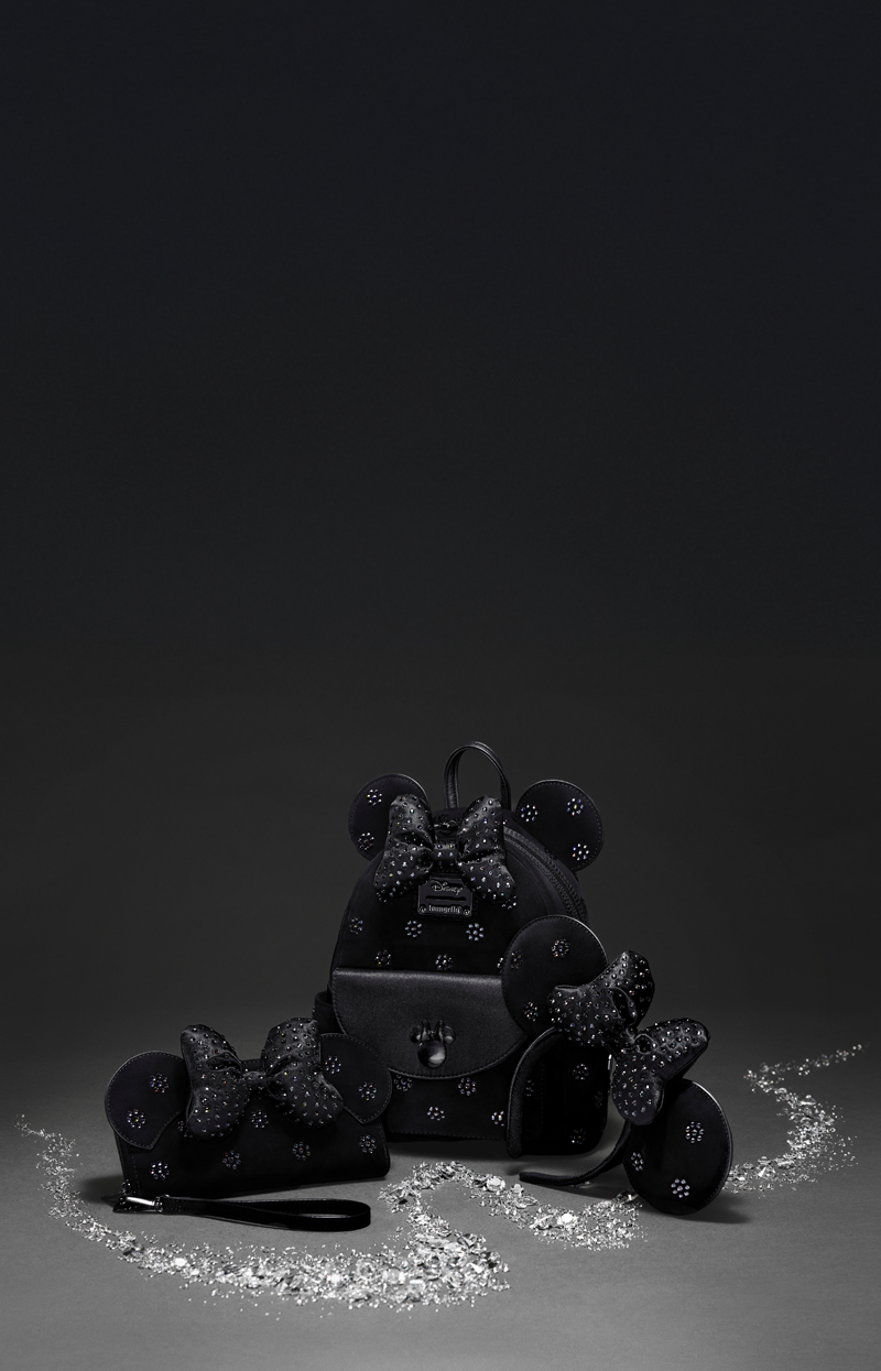 black background with selection of swrovski loungefly items 