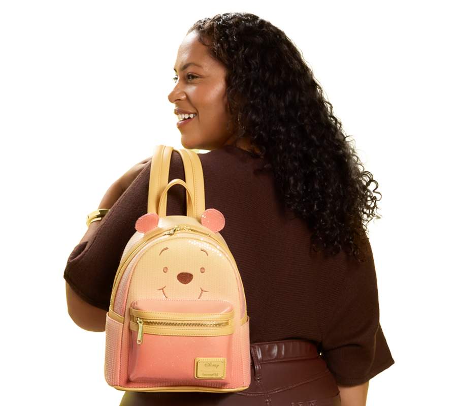 model with Winnie the Pooh Loungefly backpack