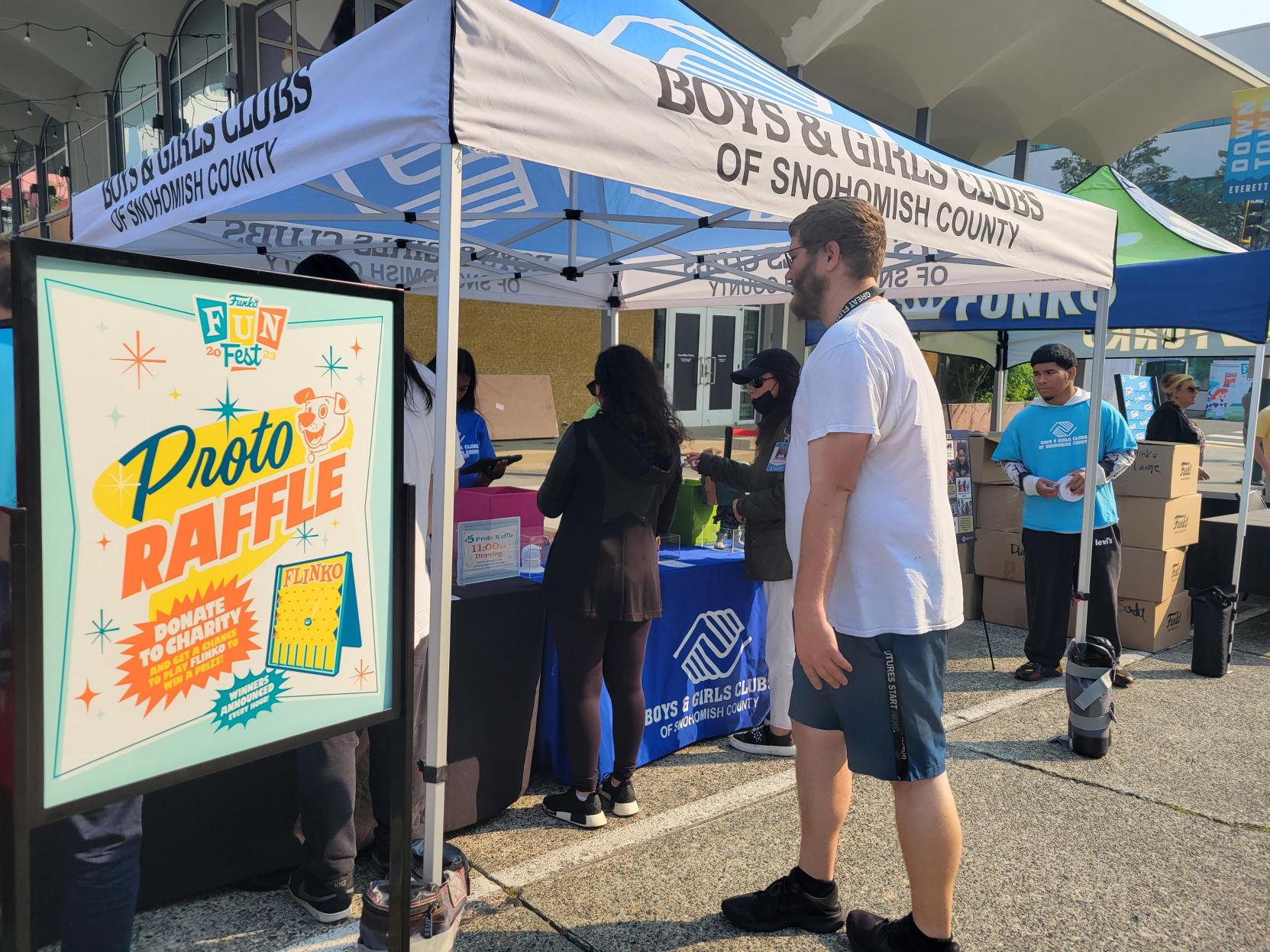 Proto Raffle: Funatics line up at the Boys and Girls Clubs of Snohomish County tent to try their hand at Flinko and win a proto.