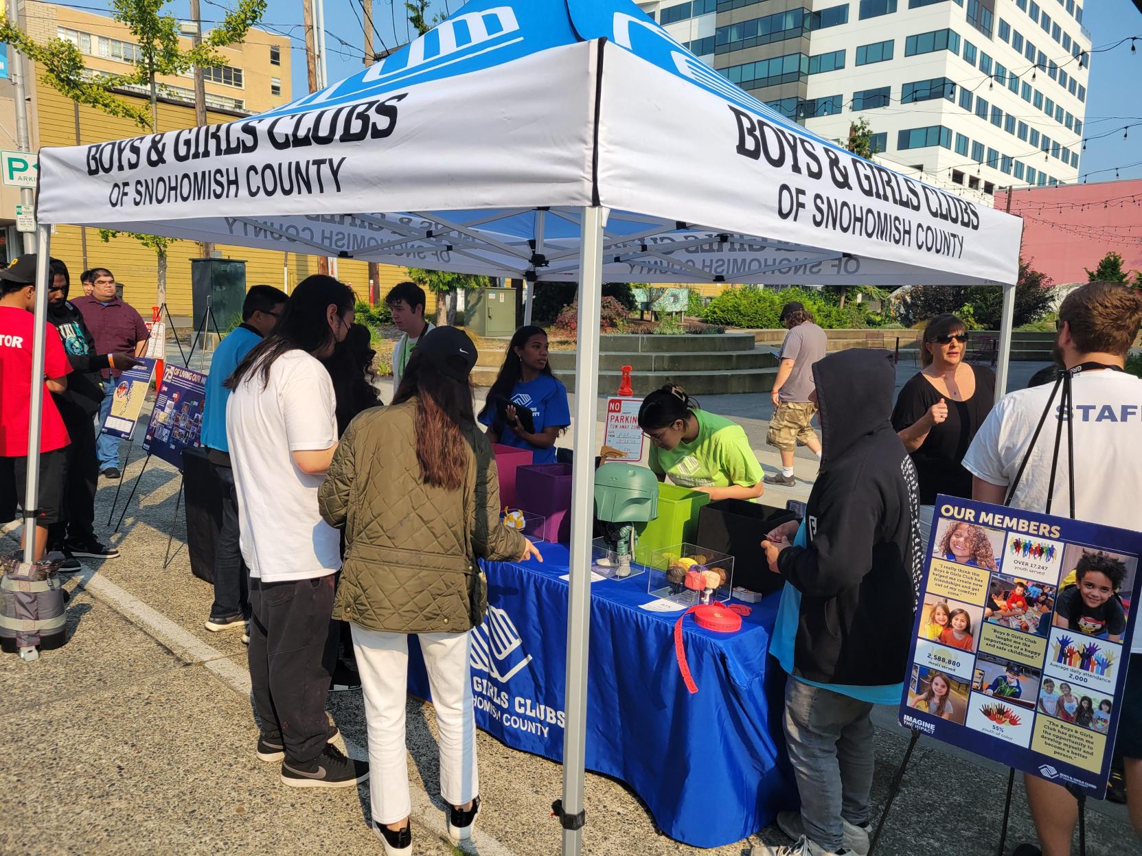Boys and Girls Clubs of Snohomish County Tent: Funatics line up to visit the informational booth.