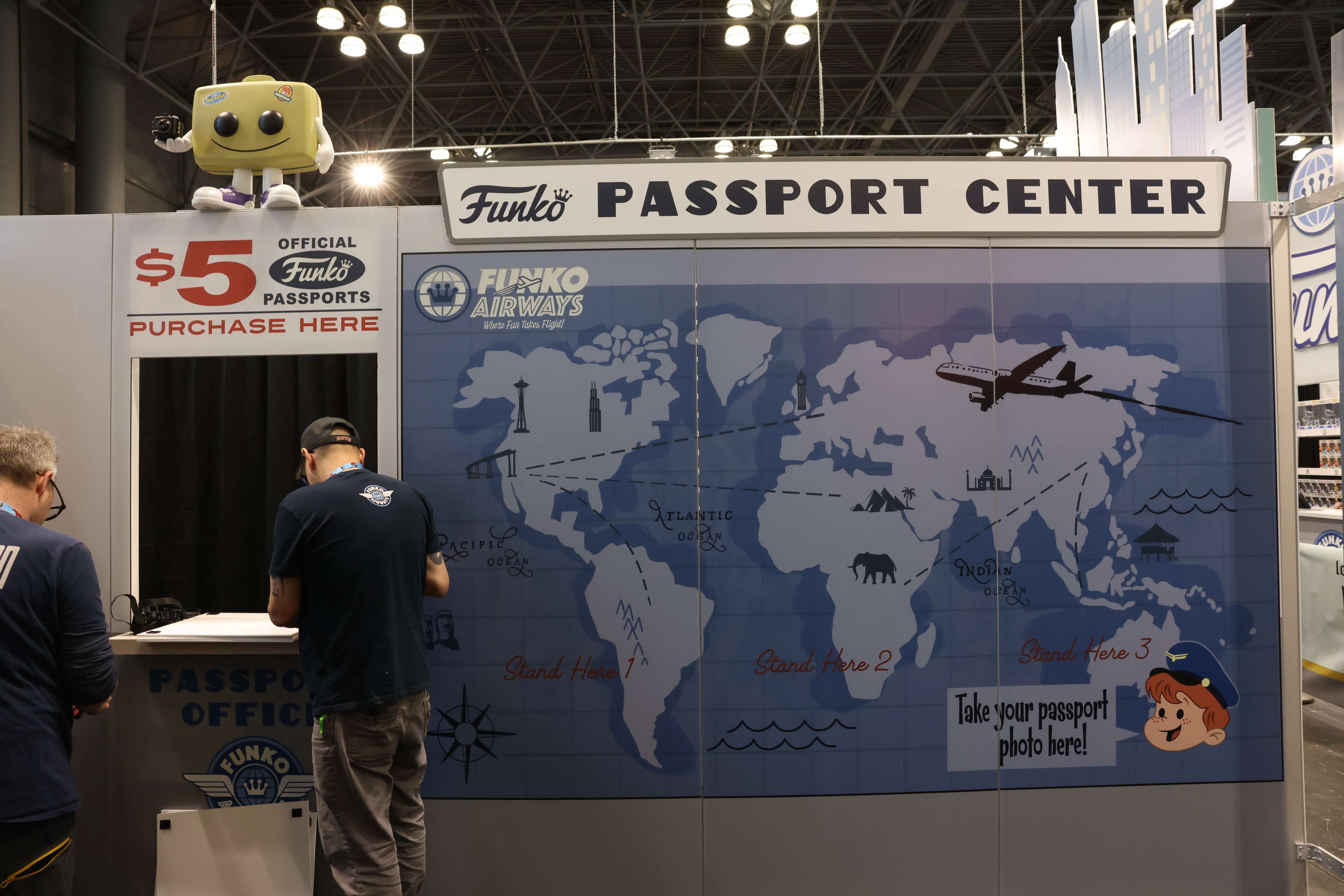 Fans at the passport center. There's a map on the wall.