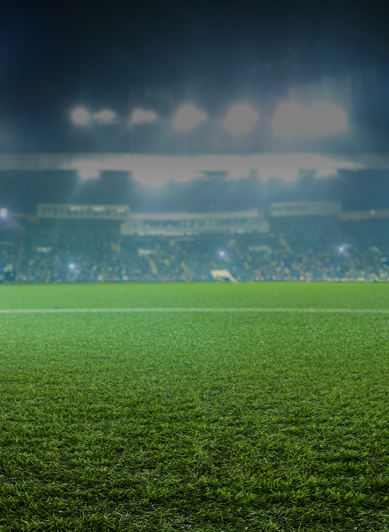 F&uacute;tbol stadium background with Green grass field and stadium lights