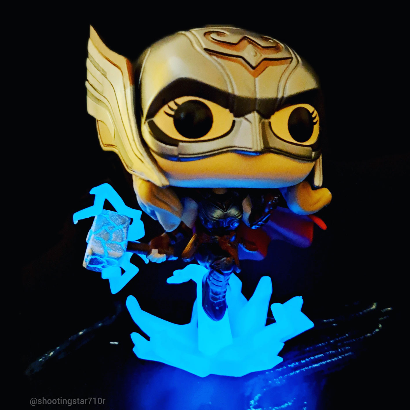 The Mighty Thor Jane Foster Funko Pop! glowing in a darkened room