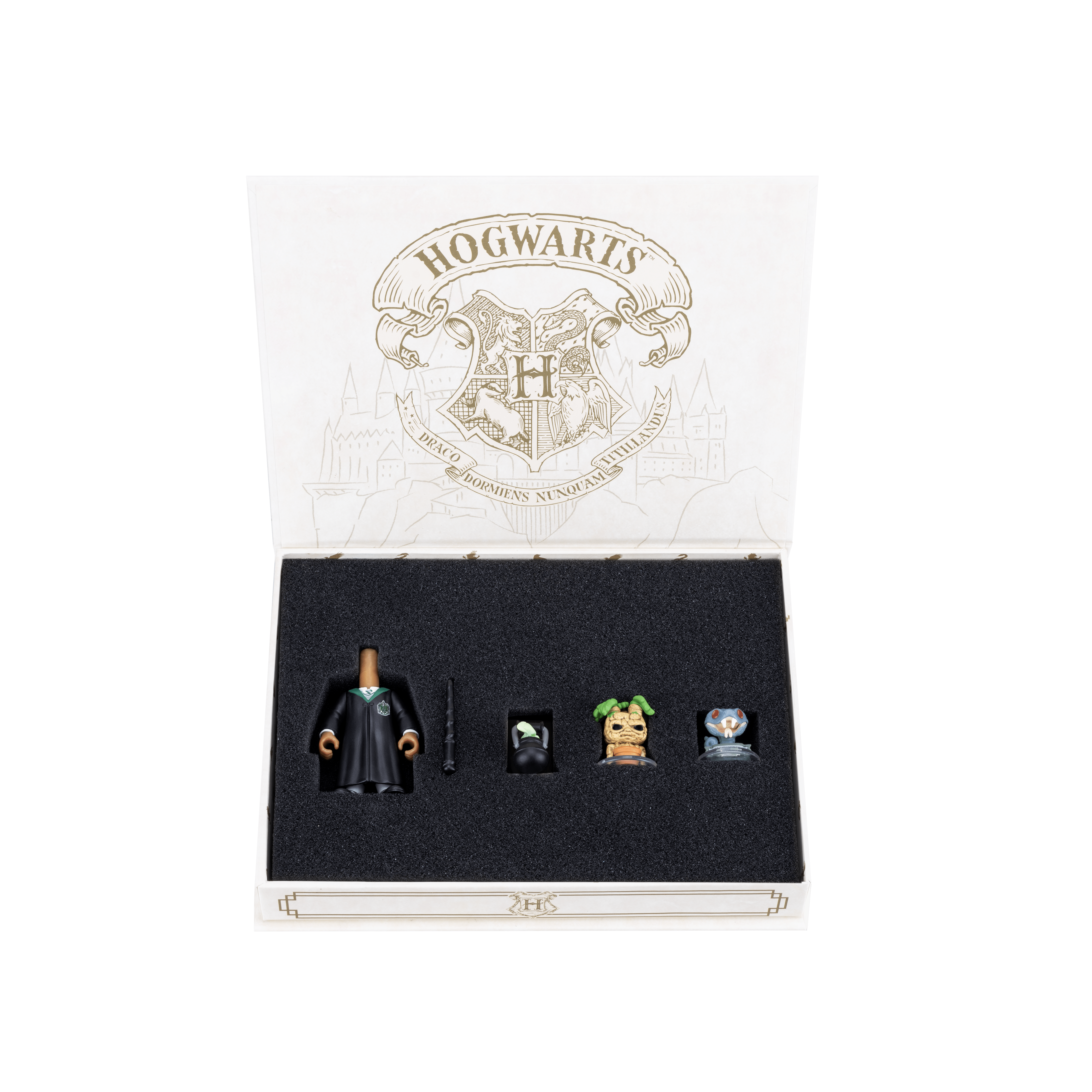Slytherin Accessory Pack with the box lid open, revealing all the accessories secured inside a velvet lining. Items include the body and robe, a black wand, mascot, mandrake, and cauldron