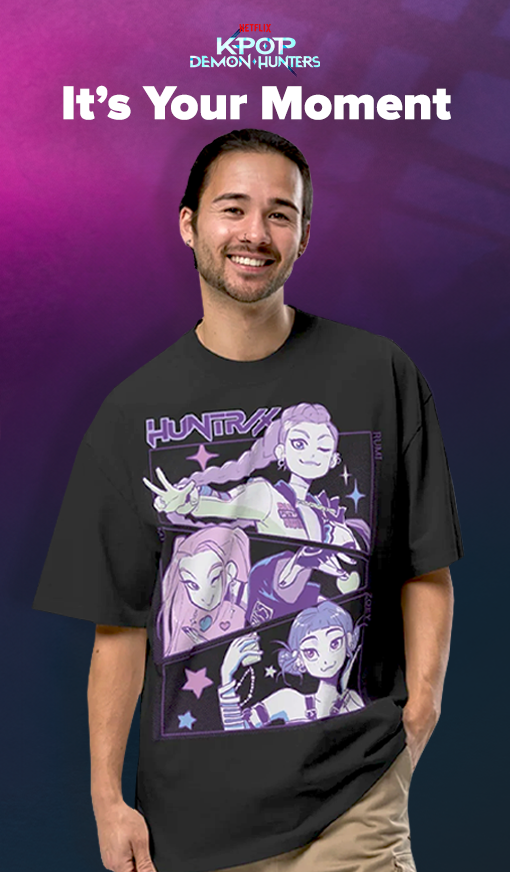 Pink the Dark Blue gradient background with model wearing Kpop Demon Hunters tee with White text saying "It's Your Moment" along with Netflix KPop Demon Hunters logo