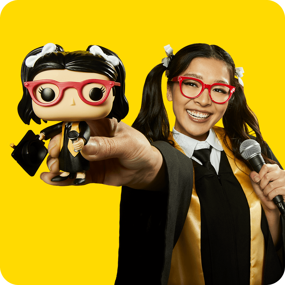 Yellow background with grad holding a custom Funko POP! Yourself vinyl figure