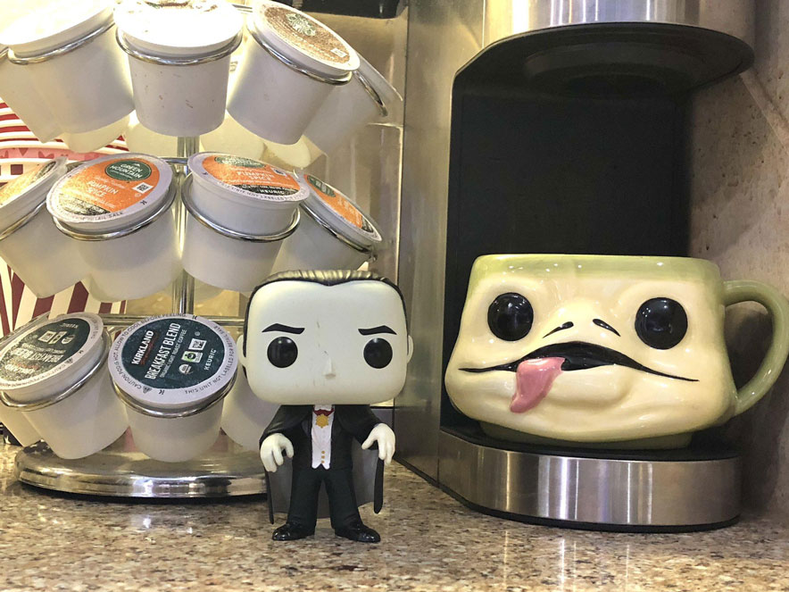Universal Monsters Dracula and a Jabba the Hut mug caffeinating