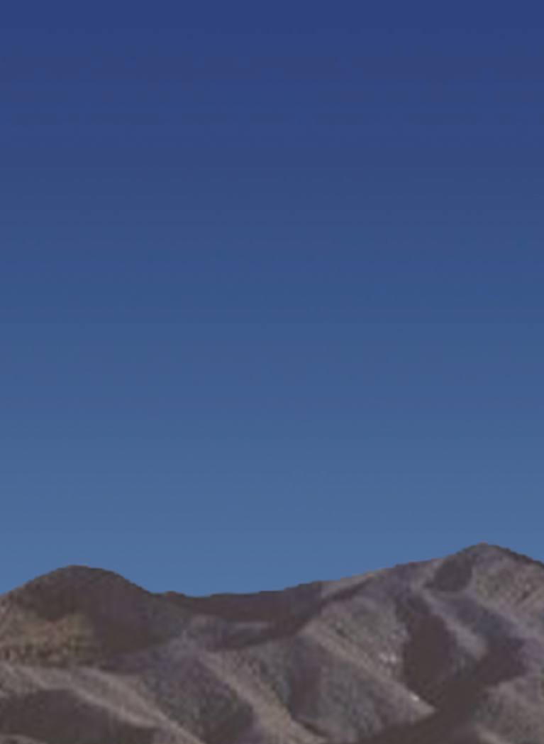 Cartoon desert background with dusk sky and rolling dirt mountains
