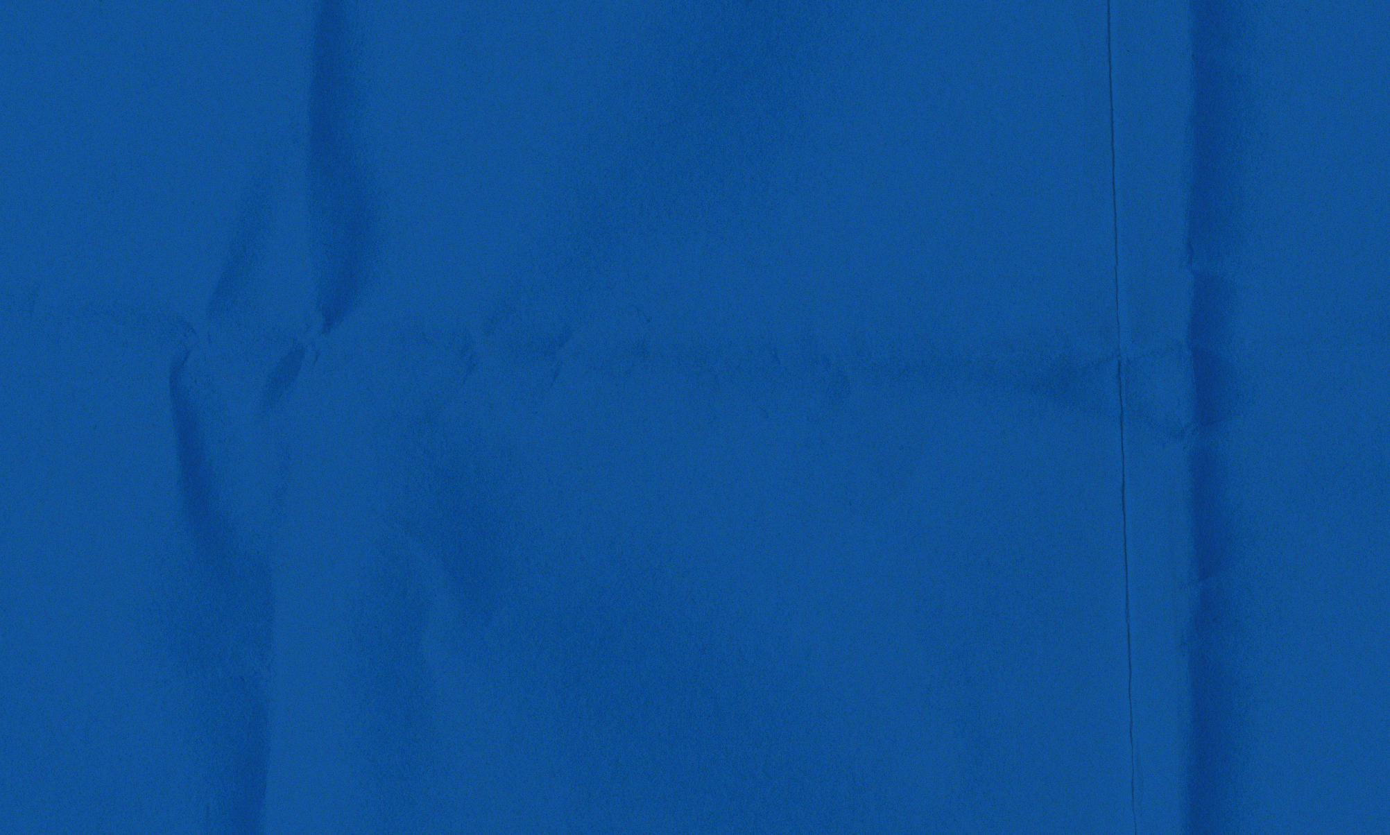 Blue background with crumpled paper texture