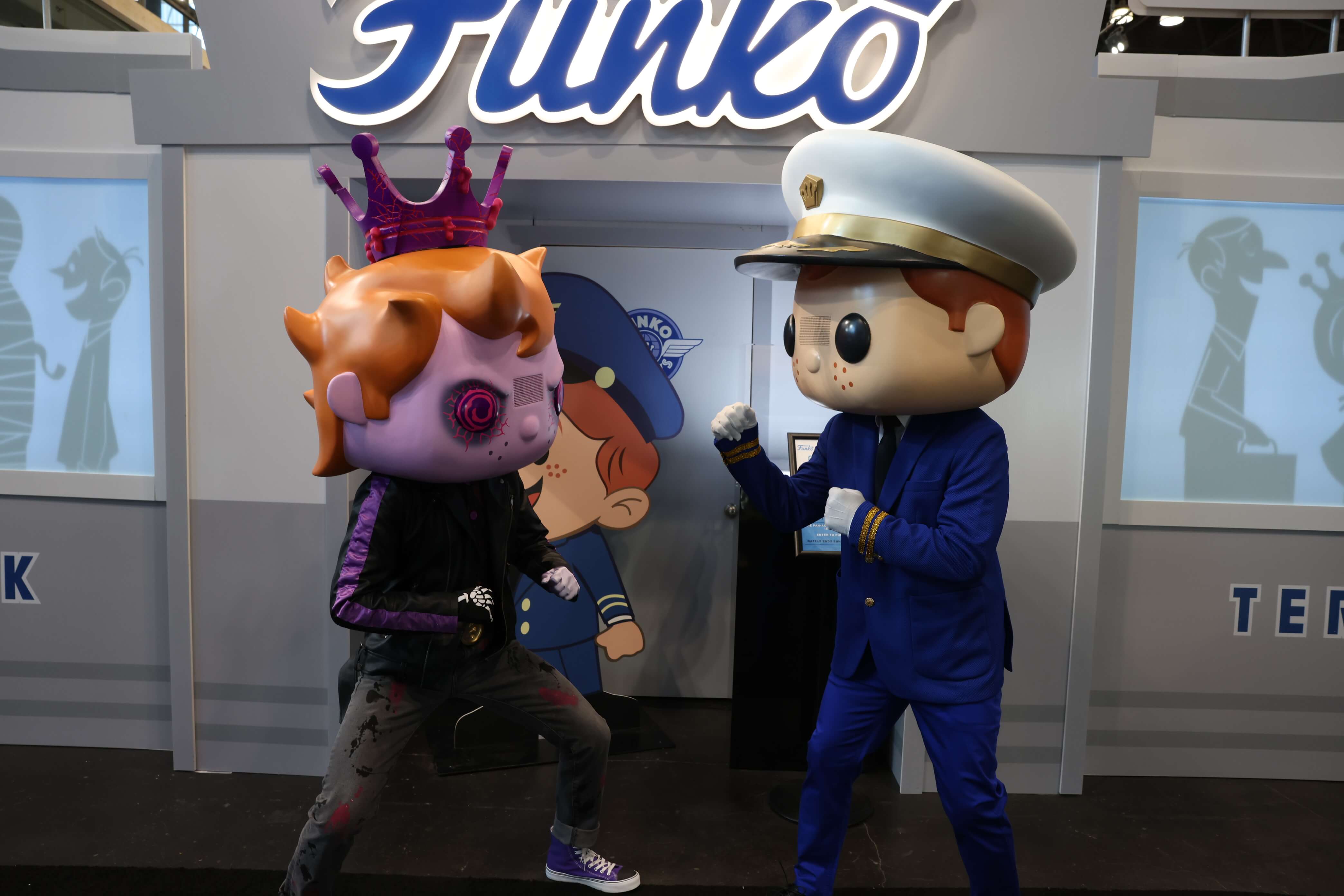 Freddy and Eddy mascots "fighting."