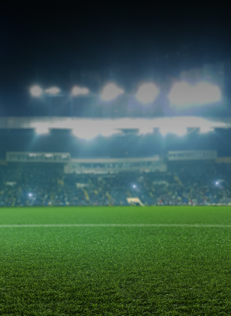 Stadium background bright flood lights and Green grass field