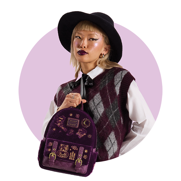 Circle-cropped photo with Purple background and model showcasing Loungefly Sanrio Halloween Velvet Mini Backpack exclusive