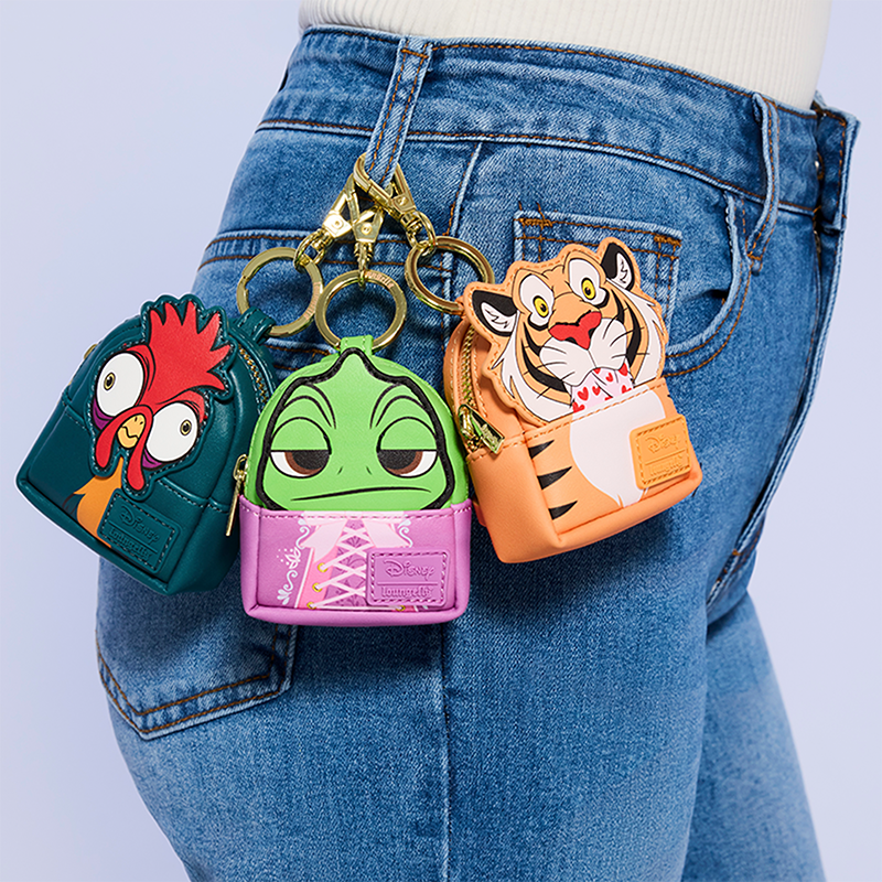 Light Purple background with model showcasing Loungefly Disney Sidekicks Mystery Keychains