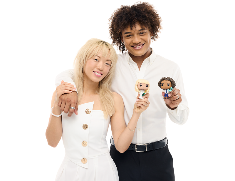 Models wearing wedding attire holding custom Pop! Yourself figures in wedding accessories