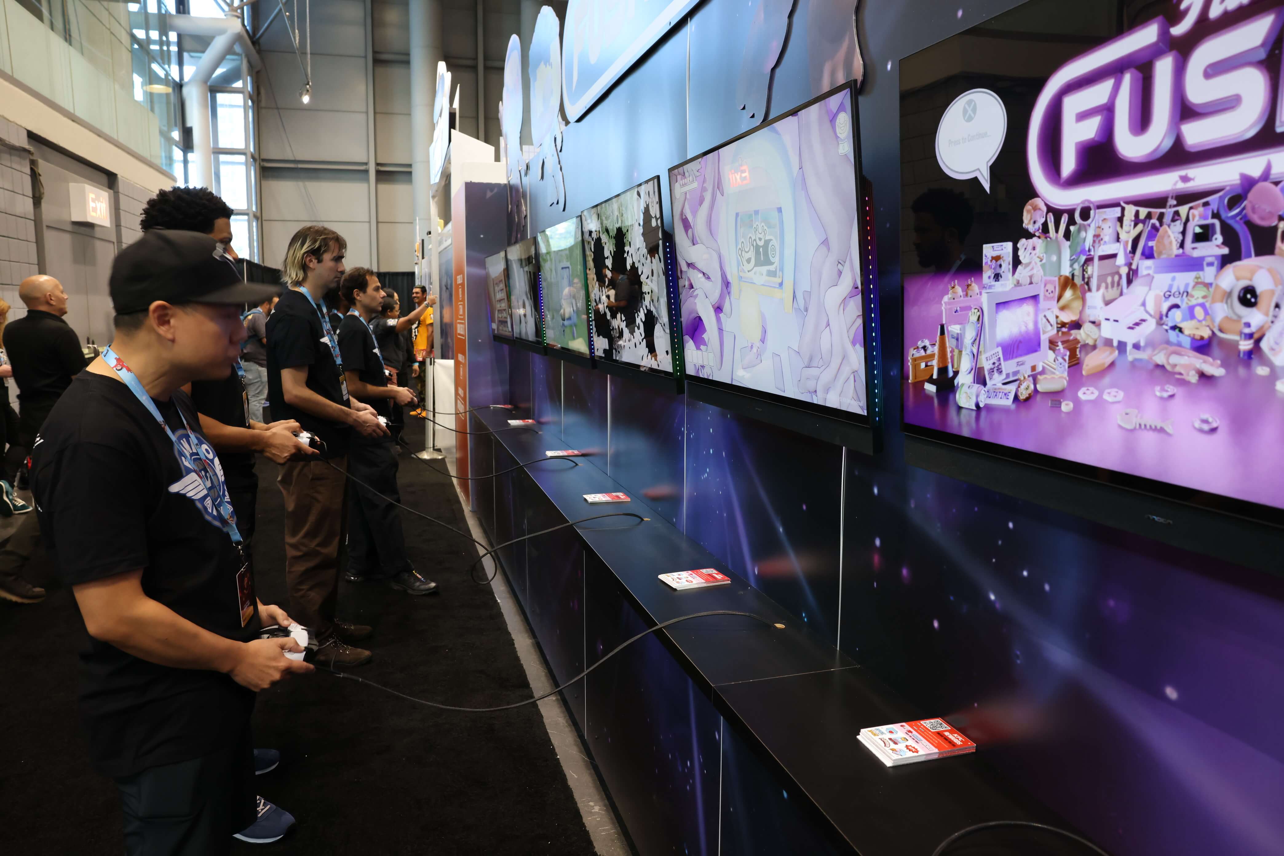 Fans playing Funko Fusion at the booth.