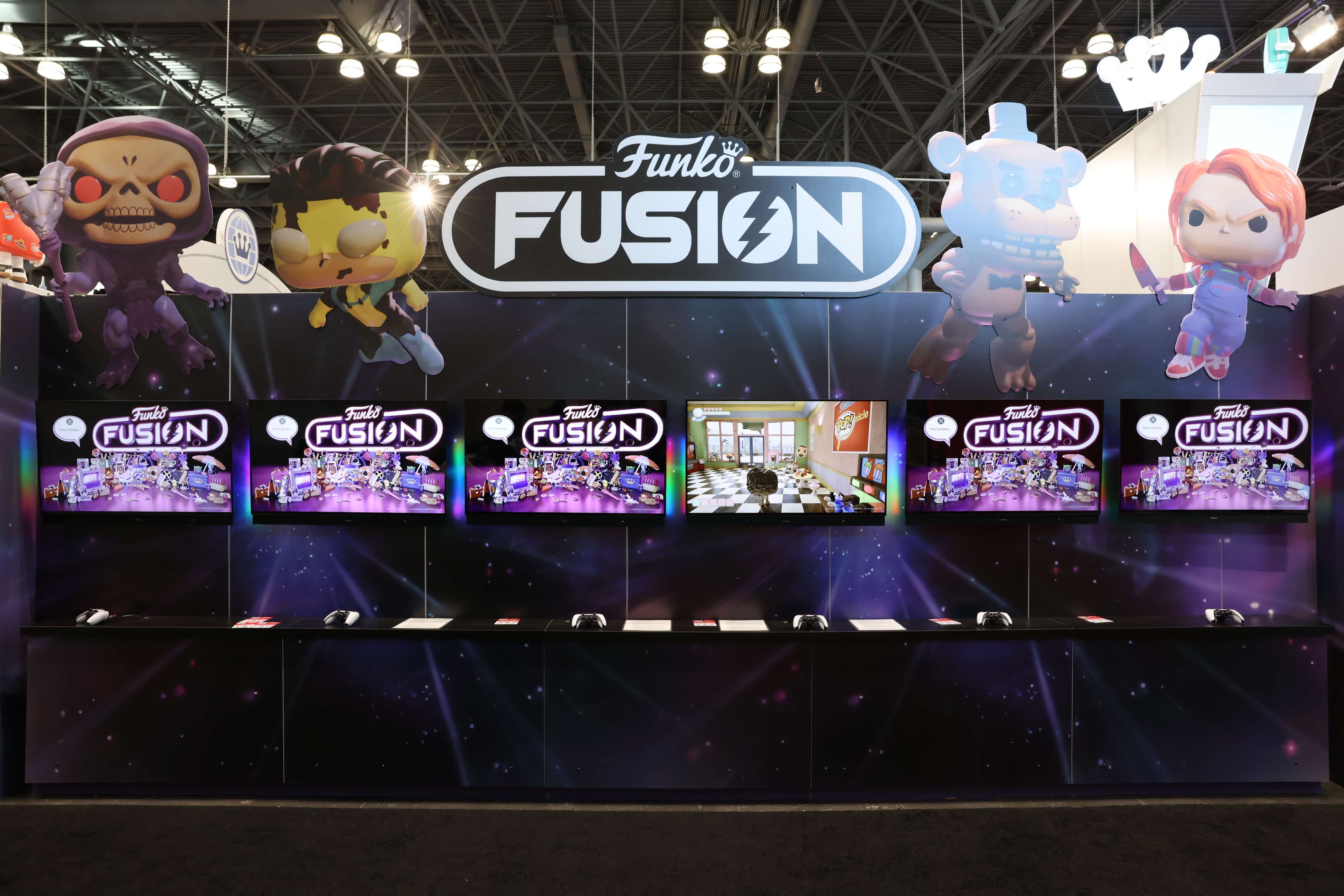 Funko Fusion booth with gaming stations and television screens.